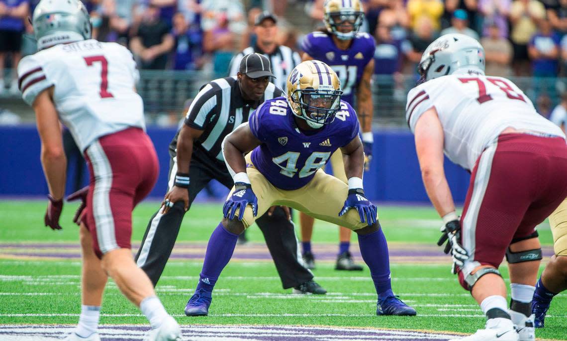 UW linebacker Edefuan Ulofoshio lines up near the line of scrimmage. The Washington Huskies played the Montana Grizzlies at Husky Stadium in Seattle, Wash., on Saturday, Sept. 4, 2021.