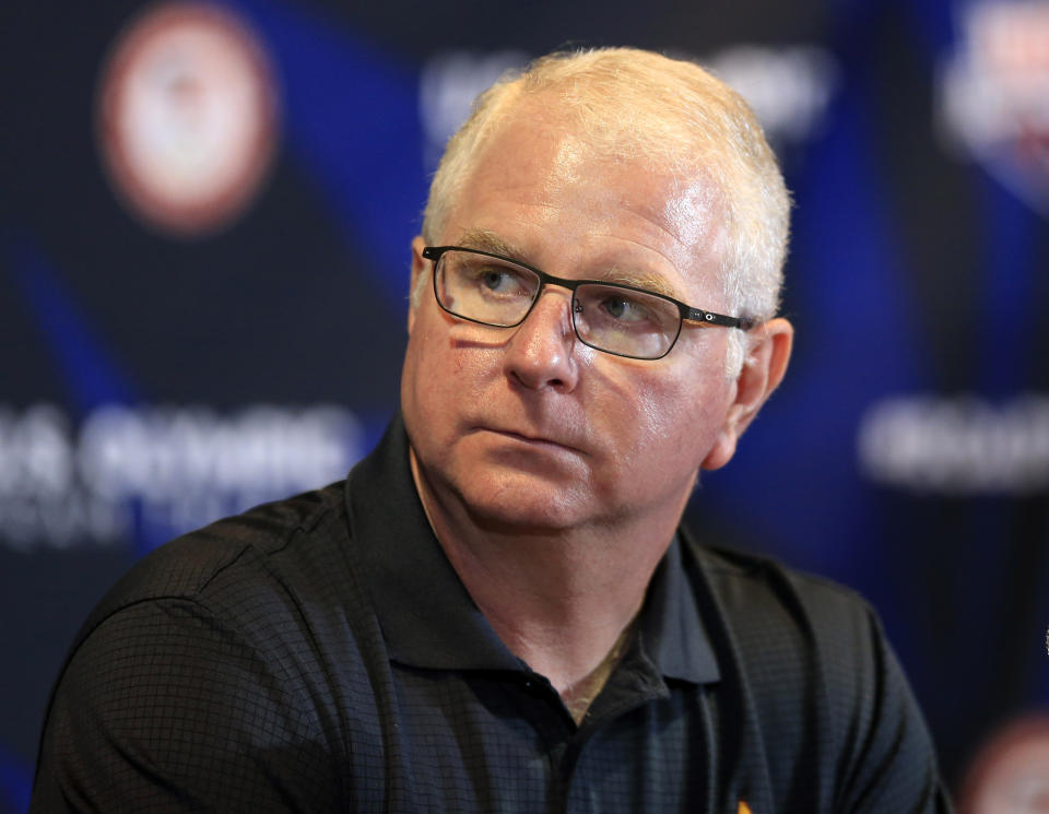 FILE - U.S. Olympic team coach Bob Bowman listens to a question during a news conference at the U.S. Olympic team swimming trials in Omaha, Neb., June 25, 2016. When Bob Bowman was coaching the world’s greatest swimmer, he’d be the first to concede he was not a very nice person at the pool. (AP Photo/Orlin Wagner, File)