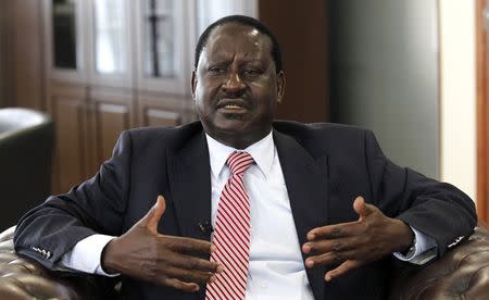 Kenya's former Prime Minister and opposition leader Raila Odinga talks during an interview with Reuters inside his office at the Capitol Hill Square in Nairobi, June 24, 2014. REUTERS/Thomas Mukoya