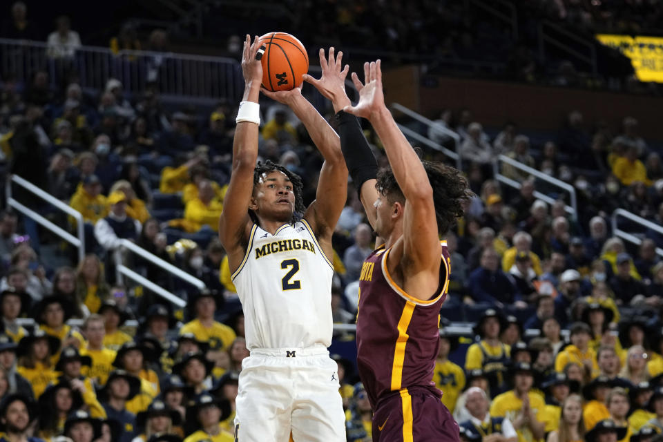 Michigan guard Kobe Bufkin (2) shoots on Minnesota forward Dawson Garcia (3) in the second half of an NCAA college basketball game in Ann Arbor, Mich., Sunday, Jan. 22, 2023. (AP Photo/Paul Sancya)