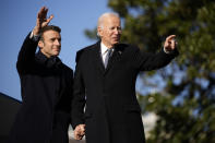 President Joe Biden and French President Emmanuel Macron stand on the stage during a State Arrival Ceremony on the South Lawn of the White House in Washington, Thursday, Dec. 1, 2022. (AP Photo/Andrew Harnik)