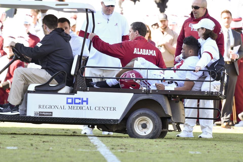 Alabama Crimson Tide quarterback Tua Tagovailoa (13) is carted off the field due to an injury. (USA Today)