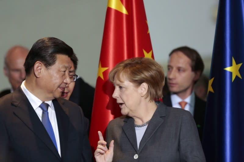 時任德國總理的梅克爾與中國國家主席習近平。（美聯社）