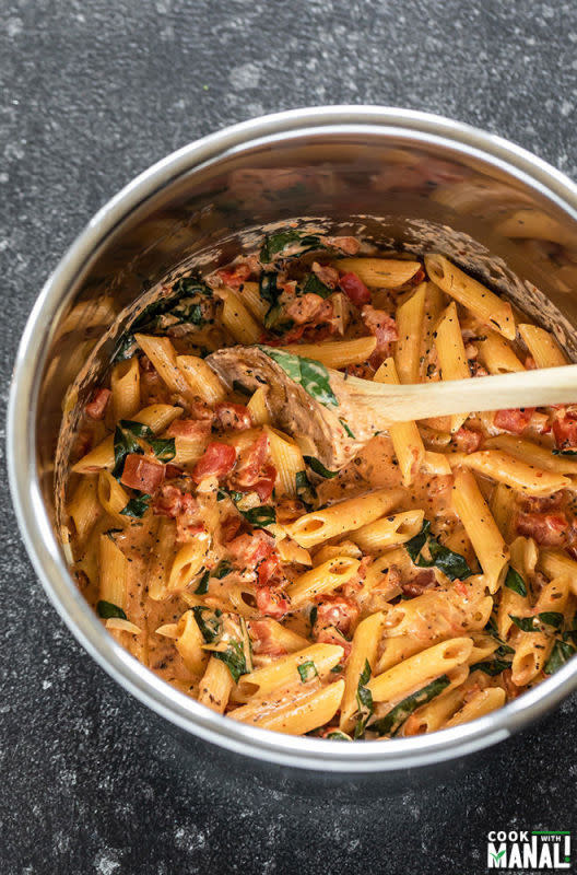 <p>Cooking with Manali</p><p>Creamy tomato basil pasta gets done in the Instant Pot in only 20 minutes! Perfect one-pot meal for busy days!</p><p><strong>Get the recipe: <a href="https://www.cookwithmanali.com/instant-pot-creamy-tomato-basil-pasta/" rel="nofollow noopener" target="_blank" data-ylk="slk:Instant Pot Creamy Tomato Basil Pasta;elm:context_link;itc:0;sec:content-canvas" class="link rapid-noclick-resp">Instant Pot Creamy Tomato Basil Pasta</a></strong></p>