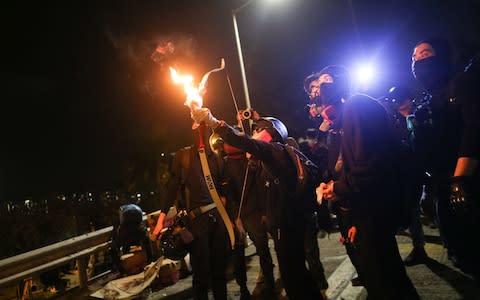 Pro-democracy protesters prepare for a possible clash with the police at the Chinese University of Hong Kong - Credit: JEROME FAVRE/EPA