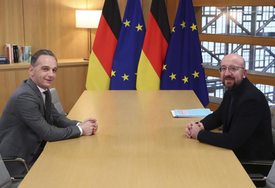 European Council President Charles Michel, right, and Germany's Foreign Minister Heiko Maas pose for photographers prior to a meeting at the Europa building in Brussels, Monday, Jan. 20, 2020. (Yves Herman, Pool Photo via AP)