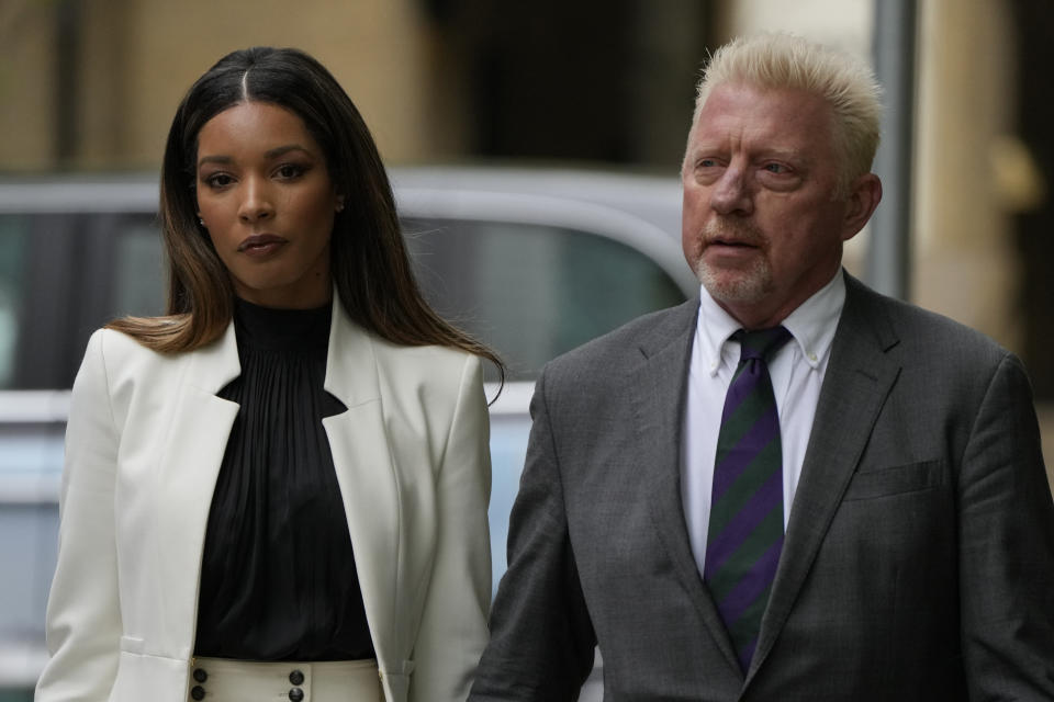 Former Tennis player Boris Becker with Lilian de Carvalho Monteiro as they arrive at Southwark Crown Court for sentencing in London, Friday, April 29, 2022. Becker was found guilty earlier of dodging his obligation to disclose financial information to settle his debts.(AP Photo/Alastair Grant)