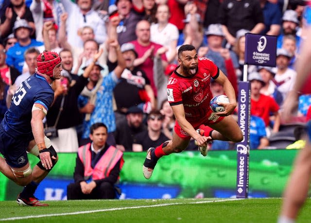 Toulouse's Matthis Lebel leaps over the try line to score against Leinster