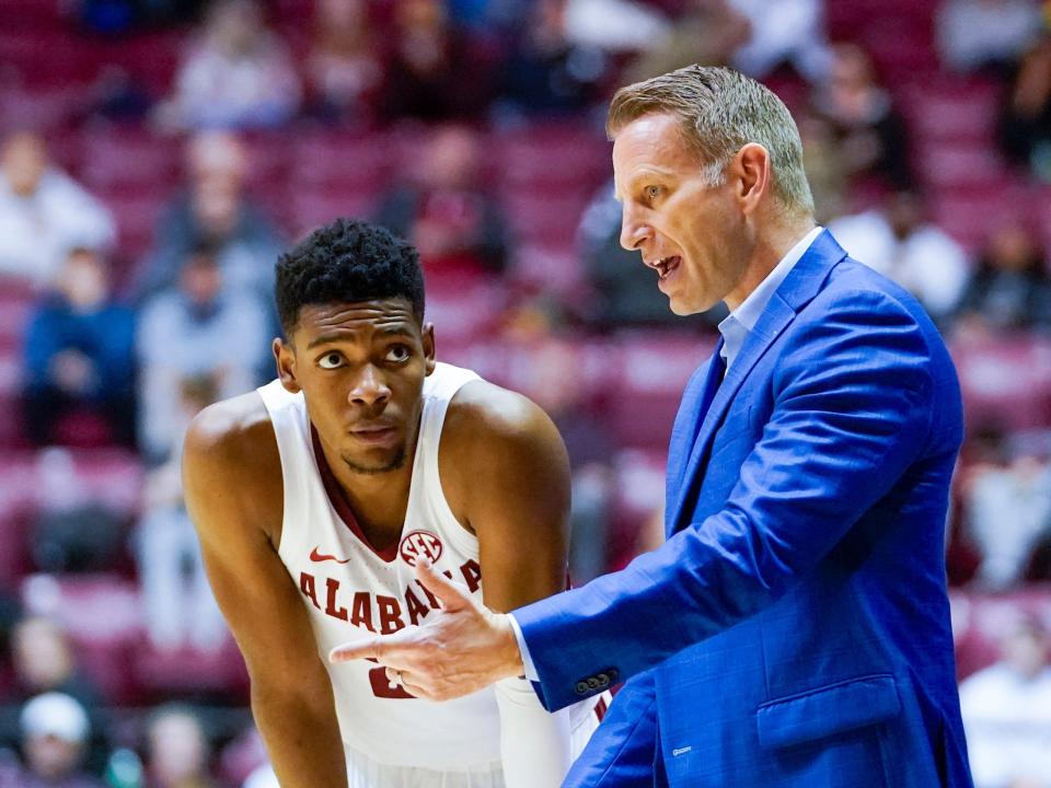 Brandon Miller (left) and Alabama Crimson Tide head coach Nate Oats.