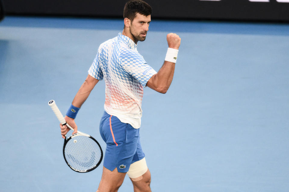 Novak Djokovic (pictured) celebrates winning a point.