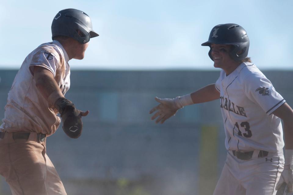 La Salle senior Brian Baquero, right, cheers after their victory against Pennsbury at Abraham Lincoln High School in Philadelphia on Monday, June 6, 2022. The Explorers defeated the Falcons 9-6 in the first round of PIAA baseball championship in class 6A.