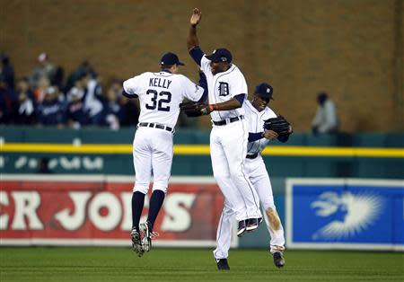 Oct 16, 2013; Detroit, MI, USA; Detroit Tigers left fielder Don Kelly (32), right fielder Torii Hunter (center) and center fielder Austin Jackson (right) celebrate after defeating the Boston Red Sox 7-3 in game four of the American League Championship Series baseball game at Comerica Park. Rick Osentoski-USA TODAY Sports