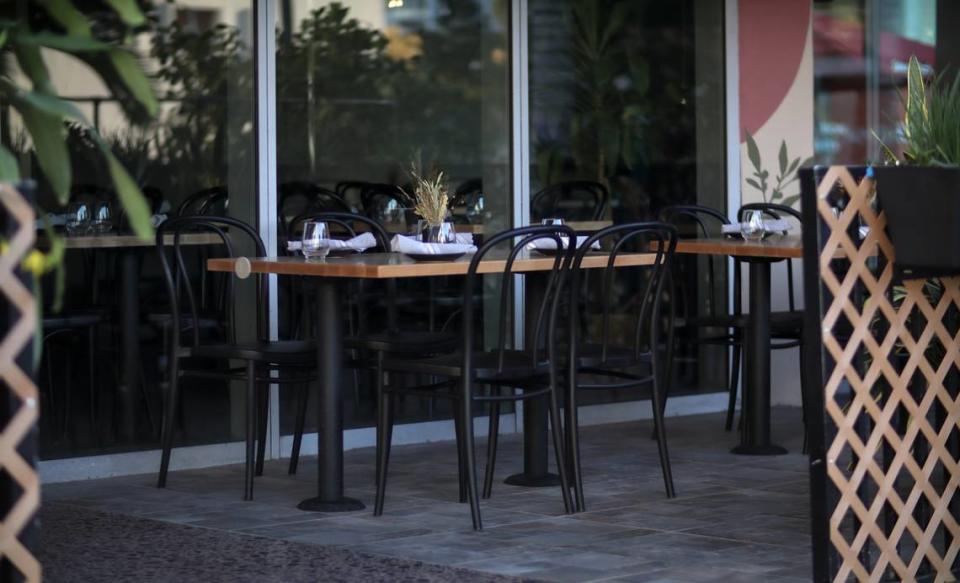 Outdoor seating is available at Petite Comité from the 11 Ktchn Group.