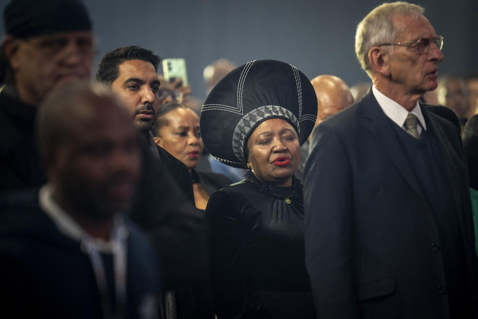 Attendants sing the national anthem at the National Results Operations Center during the announcement of the results in South Africa's general elections, in Johannesburg, South Africa on Sunday, June 2, 2024. Humbled by a stinging election result, South Africa's African National Congress was talking to everyone in an effort to form a stable coalition government for Africa's most advanced economy after it lost its 30-year majority. (AP Photo/Emilio Morenatti)