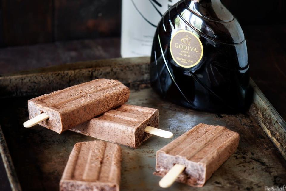 <p>Not all alcoholic ice lollies need be fruity. These chocolatey ones boast a splash of Martini and are perfect as a post-dinner adult treat. Recipe <a href="http://passthesushi.com/chocolate-martini-pudding-pops/" rel="nofollow noopener" target="_blank" data-ylk="slk:here." class="link rapid-noclick-resp">here. </a><br></p>