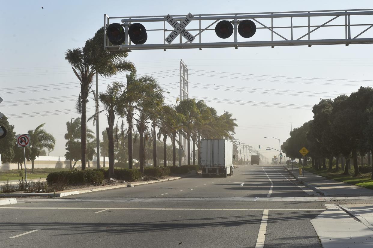 Strong Santa Ana winds kicked up dust on Hueneme Road in Oxnard in 2020. On Saturday, thousands of Ventura County residents had power shut off as Santa Anas brought dangerous fire weather.