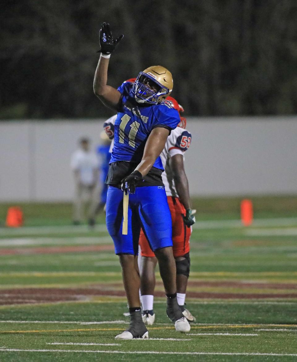 Mainland’s LJ Mccray (11) celebrates a sack during Friday night’s game against Vanguard.