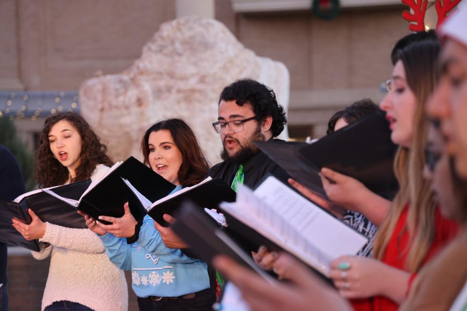 The West Texas A&M University Chamber Singers, led by Director Dr. Sean Pullen, sing their Christmas concert for the 2021 Festival of Lights at the WTAMU Pedestrian Mall.