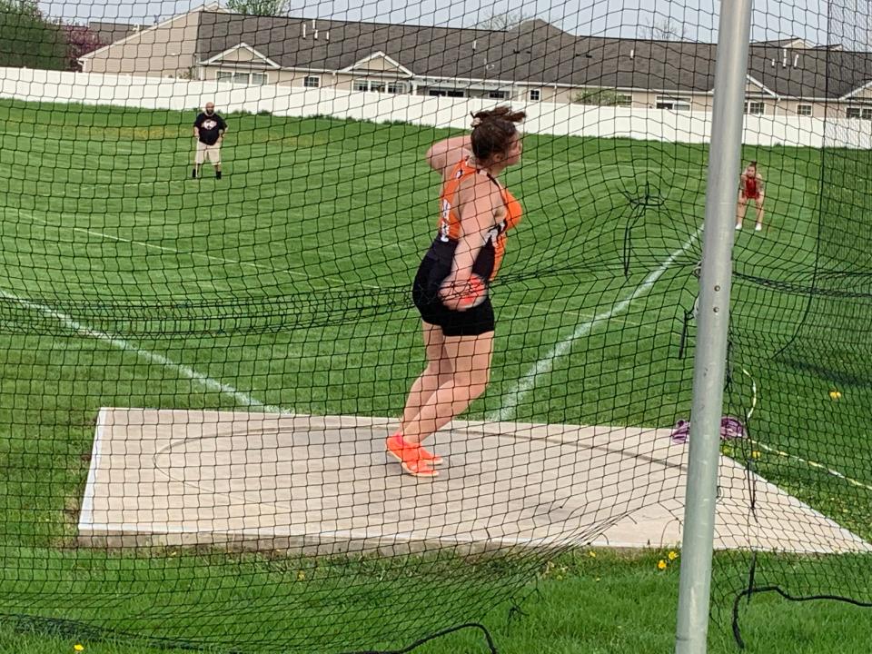 Harlem's Emma Rich lets loose on a discus toss during the postseason as she worked toward qualifying for state, which will be held in Charleston this week and will end with the finals on Saturday, May 21, 2022.