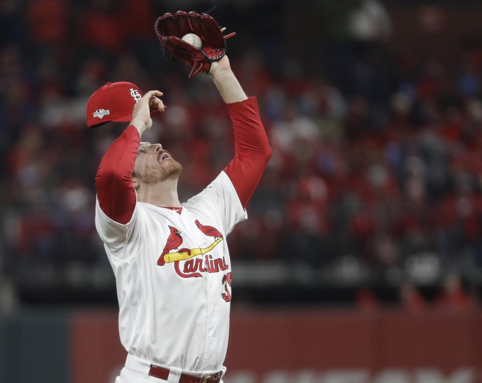 St. Louis Cardinals' Miles Mikolas reacts after walking the bases loaded during the fifth inning of Game 1 of the baseball National League Championship Series against the Washington Nationals Friday, Oct. 11, 2019, in St. Louis. (AP Photo/Mark Humphrey)