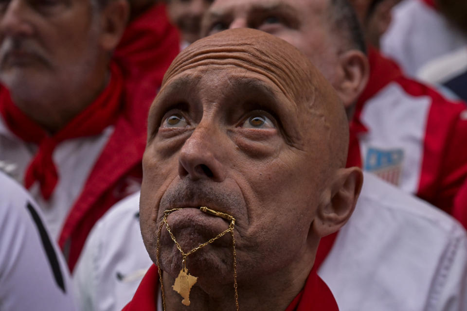 A reveller concentrates before running with La Palmosilla's fighting bulls during the first day of the running of the bulls during the San Fermin fiestas in Pamplona, Spain, Friday, July 7, 2023. (AP Photo/Alvaro Barrientos)