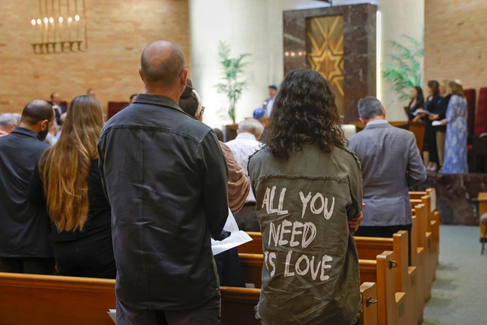 People stand near the end of the Prayer Vigil for Israel Thursday hosted by the Oklahoma City Jewish community at Temple B'nai Israel in Oklahoma City.