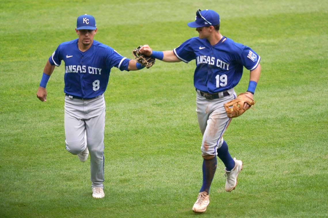 Chicago area natives Kansas City Royals shortstop Nicky Lopez (8) and second baseman Mike Massey celebrate turning an inning ending double play in the fifth of a baseball game against the Chicago White Sox, Wednesday, Aug. 3, 2022, in Chicago. (AP Photo/Charles Rex Arbogast)