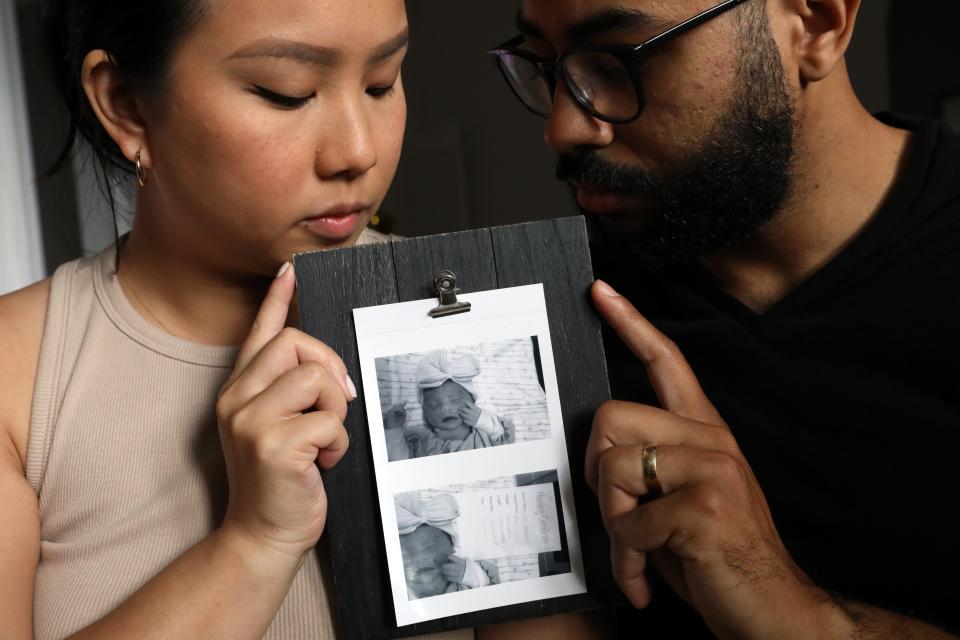 Amy Lee-Vazquez and her husband Abraham Vazquez hold photographs of their daughter Ariah, who was born still on October 4, 2019, at home in Larchmont June 22, 2022. 