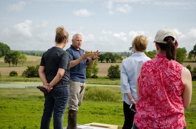 Jim Reding, second from left, showing the Land Lab to Dorothy Pelanda, Director of the Ohio Department of Agriculture.