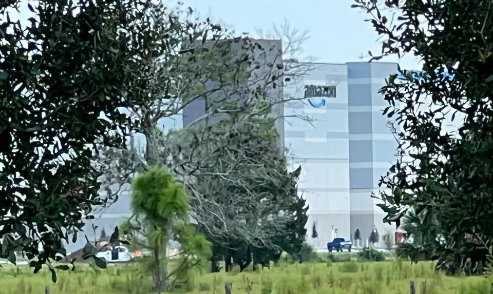 A five-story Amazon robotics fulfillment center takes shape along Williamson Boulevard, just south of Daytona International Speedway, in Daytona Beach on May 19, 2023. The 2.8 million-square-foot logistics complex is expected to open in 2024.