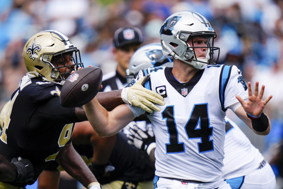 Carolina Panthers quarterback Sam Darnold passes under pressure form New Orleans Saints defensive end Cameron Jordan during the first half of an NFL football game Sunday, Sept. 19, 2021, in Charlotte, N.C. (AP Photo/Jacob Kupferman)