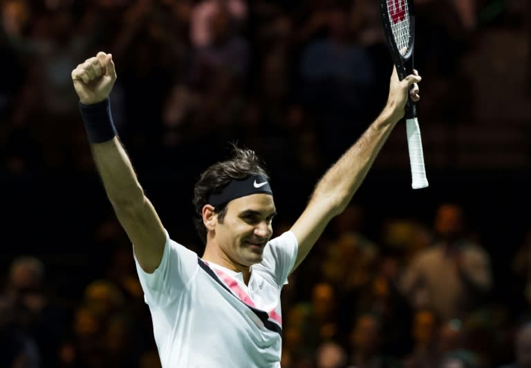 Top of the world: Roger Federer celebrates his 97th title with victory in Rotterdam