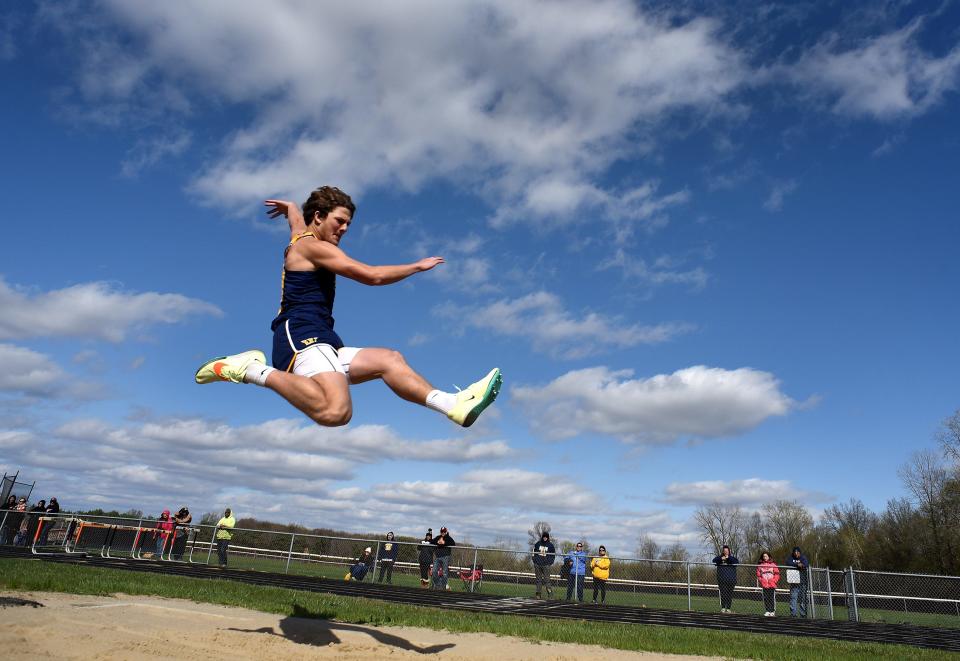 Kolby Masserant of Whiteford flies in the long jump against Erie Mason and Summerfield Tuesday, April 18, 2023.