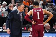 Mar 21, 2019; Salt Lake City, UT, USA; New Mexico State Aggies head coach Chris Jans speaks to guard Shunn Buchanan (1) during the second half in the first round of the 2019 NCAA Tournament against the Auburn Tigers at Vivint Smart Home Arena. Mandatory Credit: Kirby Lee-USA TODAY Sports