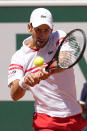 Serbia's Novak Djokovic backhands to Stefanos Tsitsipas of Greece during their final match of the French Open tennis tournament at the Roland Garros stadium Sunday, June 13, 2021 in Paris. (AP Photo/Michel Euler)