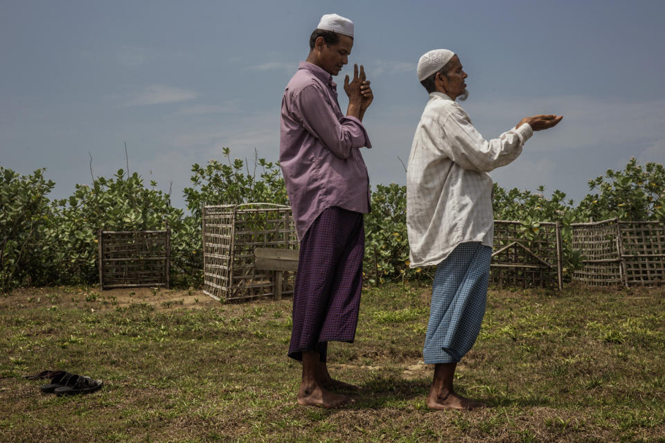 At the camp, mourners are seen at a funeral for a 16-year-old girl who drank poison.