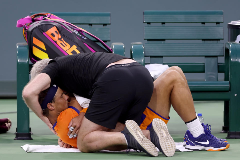 Rafa Nadal, pictured here receiving treatment for the injury at Indian Wells.