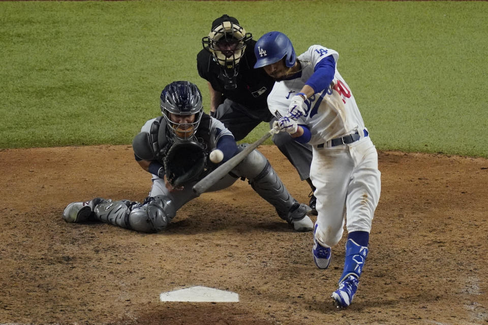 Los Angeles Dodgers' Mookie Betts hits a home run against the Tampa Bay Rays during the eighth inning in Game 6 of the baseball World Series Tuesday, Oct. 27, 2020, in Arlington, Texas. (AP Photo/Sue Ogrocki)