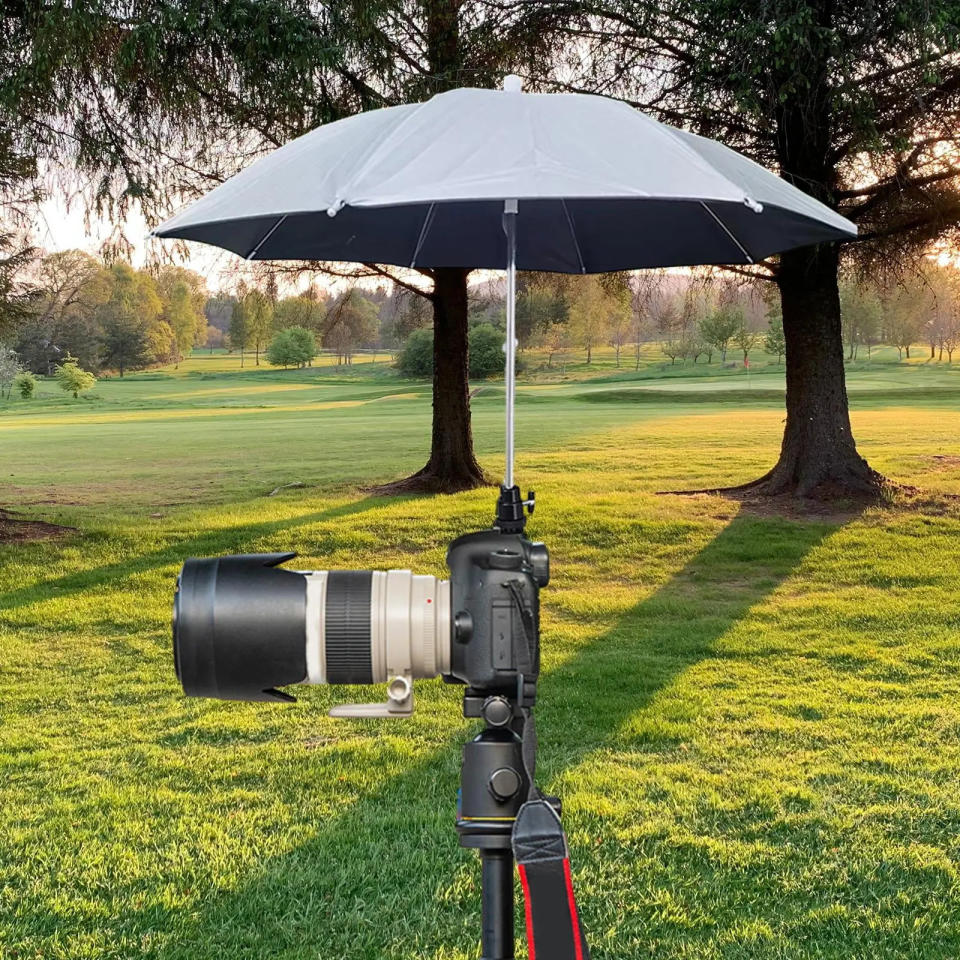 Protect your gear from the elements with a small umbrella.