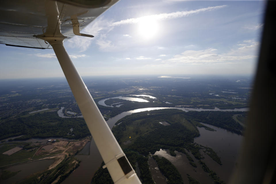 In this June 7, 2017 photo, the Red River is seen in this aerial photo from a private plane near Shreveport, La. The Department of Homeland Security plans to issue a security alert Tuesday for small planes, warning that modern flight systems are vulnerable to hacking if someone manages to gain physical access to the aircraft. A DHS alert recommends that plane owners ensure they restrict unauthorized physical access to their aircraft until the industry develops safeguards to address the issue, which was discovered by Boston-based cybersecurity company, Rapid7, and reported to the federal government. (AP Photo/Gerald Herbert)