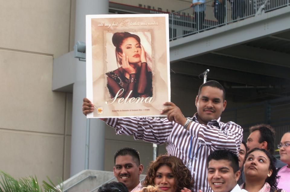 Fans of Selena and Latin music wait at the "Selena Vive" tribute concert April 7, 2005, at Reliant Stadium in Houston. Many of the stars of Latin music and television came to pay their respects and honor the memory of the pop star.