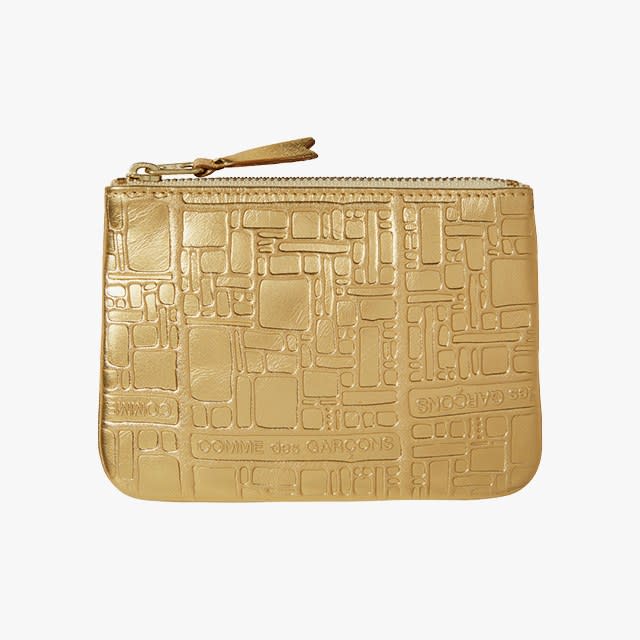 Comme des Garçons Gold Embossed Zip Wallet, £135
selfridges.com