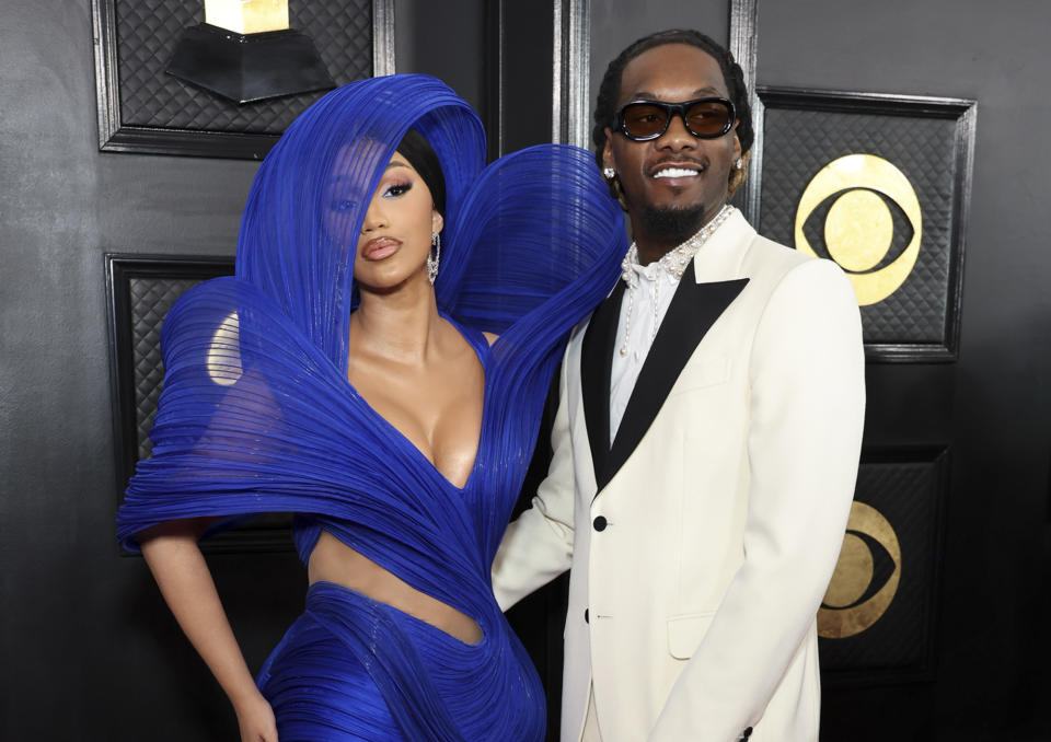 <p>"I Like It" singer Cardi B wore waves of blue in the form of an elaborate gown. Her rapper husband Offset complemented her style in a black-and-white tuxedo with a pearl-studded collar.</p>