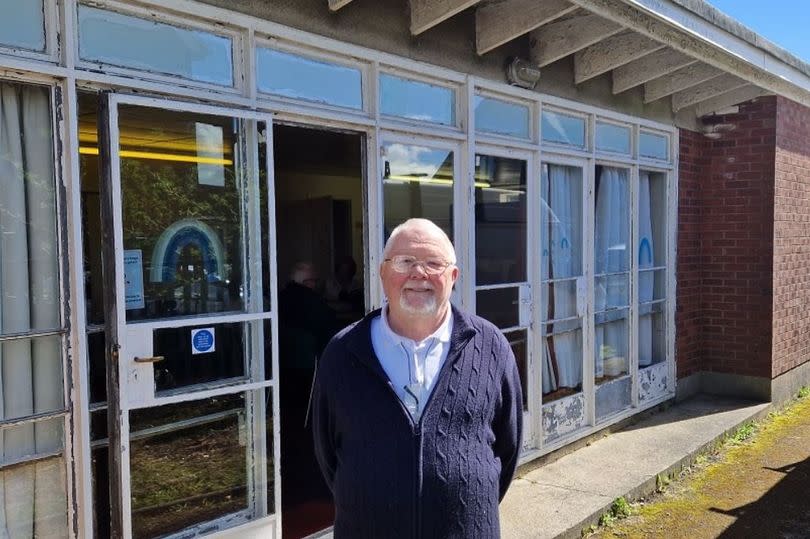 Man in front of venue