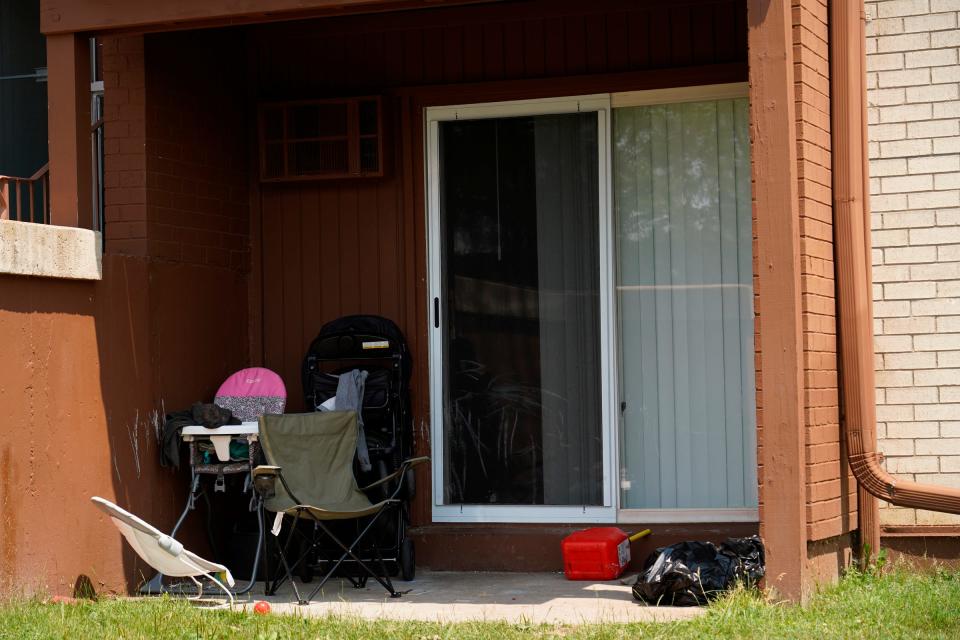 Children’s equipment is seen outside of an apartment where Rashad Trice, 26, is accused of kidnapping Wynter Cole Smith, 2, on Sunday night after stabbing and assaulting her mother at their home in the 3000 block of BeauJardin Drive in the Towne Square Apartments and Townhomes in Lansing.