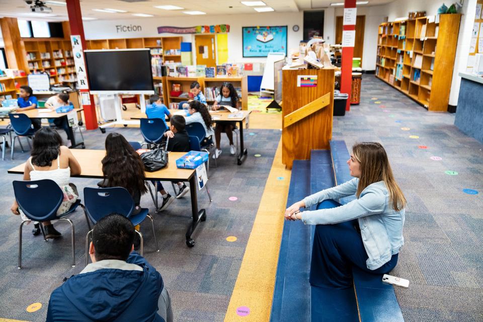 April 21, 2023; Alexandria, VA, USA; Daisy Andonyadis, a third grade teacher at Cora Kelly School, observes her students in the library Friday, April 21, 2023.. Mandatory Credit: Josh Morgan-USA TODAY [Via MerlinFTP Drop]