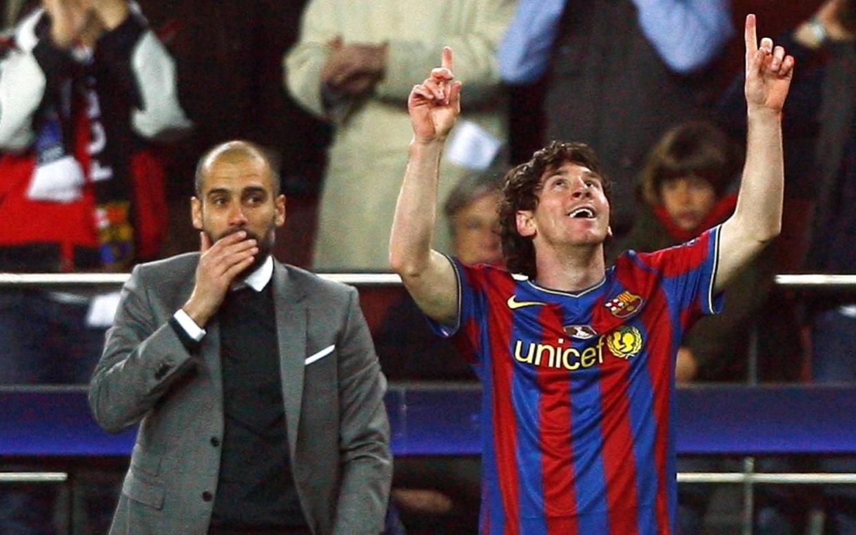 Barcelona's Lionel Messi (R) celebrates in front of his coach Pep Guardiola after scoring a goal against VfB Stuttgart - Reuters