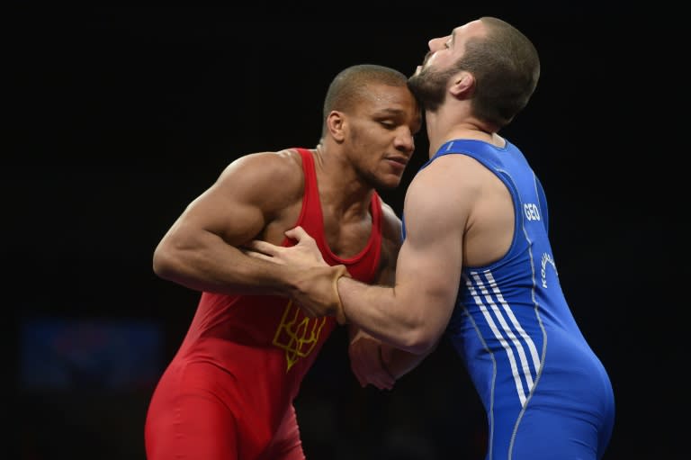 Zhan Belenyuk (L) of Ukraine and Roberti Kobiashvili of Georgia compete in the 85kg category final at the Greco-Roman Wrestling European Championships in Riga, Latvia, on March 13, 2016