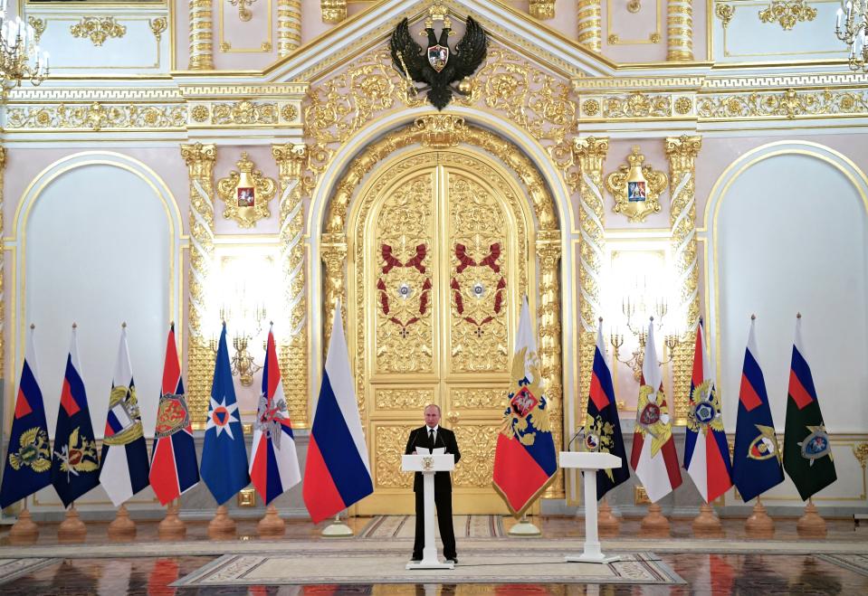 Russian President Vladimir Putin, center, speaks as he meets with top military officers and law enforcement officials in the Kremlin in Moscow, Russia, Thursday, Oct. 25, 2018. Putin said that Russia has adhered to its obligations in the arms control sphere, but noted that Russian arsenals will be modernized to ensure protection from any potential threats. (Alexei Nikolsky, Sputnik, Kremlin Pool Photo via AP)