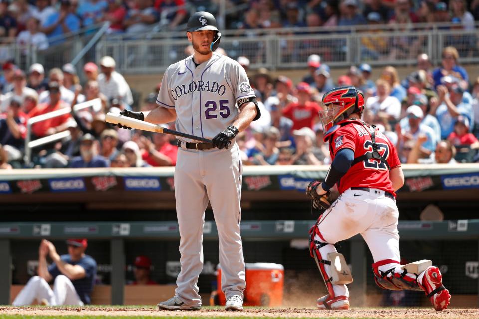 Jun 26, 2022; Minneapolis, Minnesota, USA; Colorado Rockies first baseman C.J. Cron (25) stands after striking out with the bases loaded to the Minnesota Twins to end the sixth inning at Target Field.